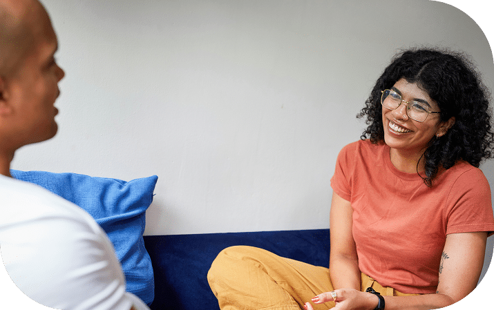 Woman speaking with doctor and smiling