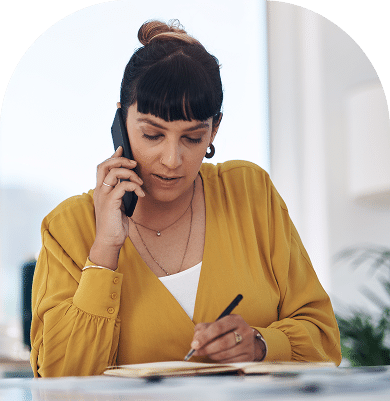 Woman at desk on phone